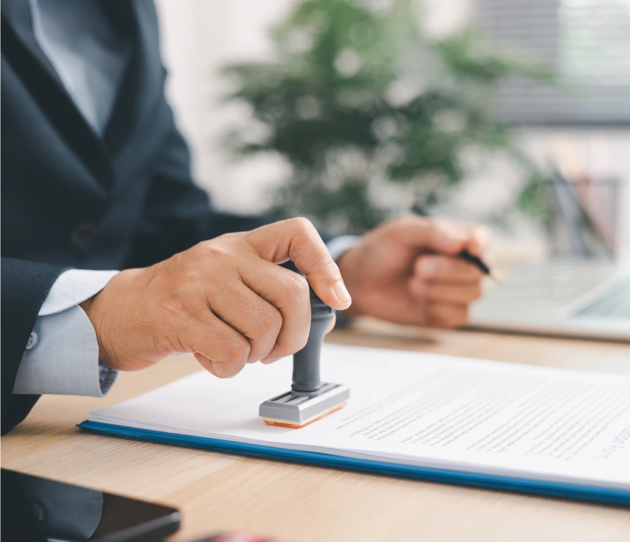 Office worker stamping a contract