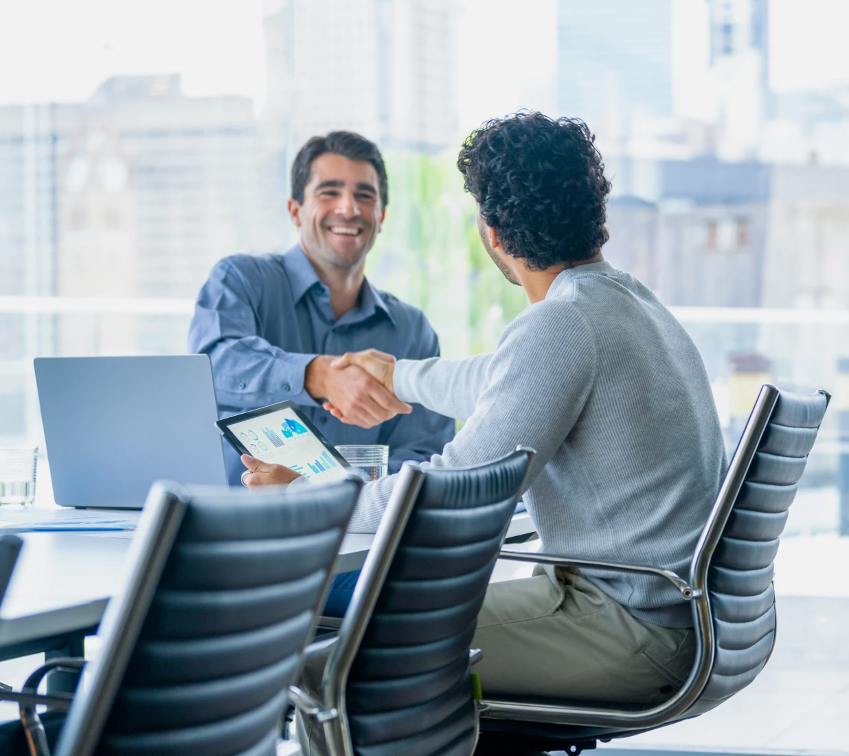 Professional handshake in modern office setting